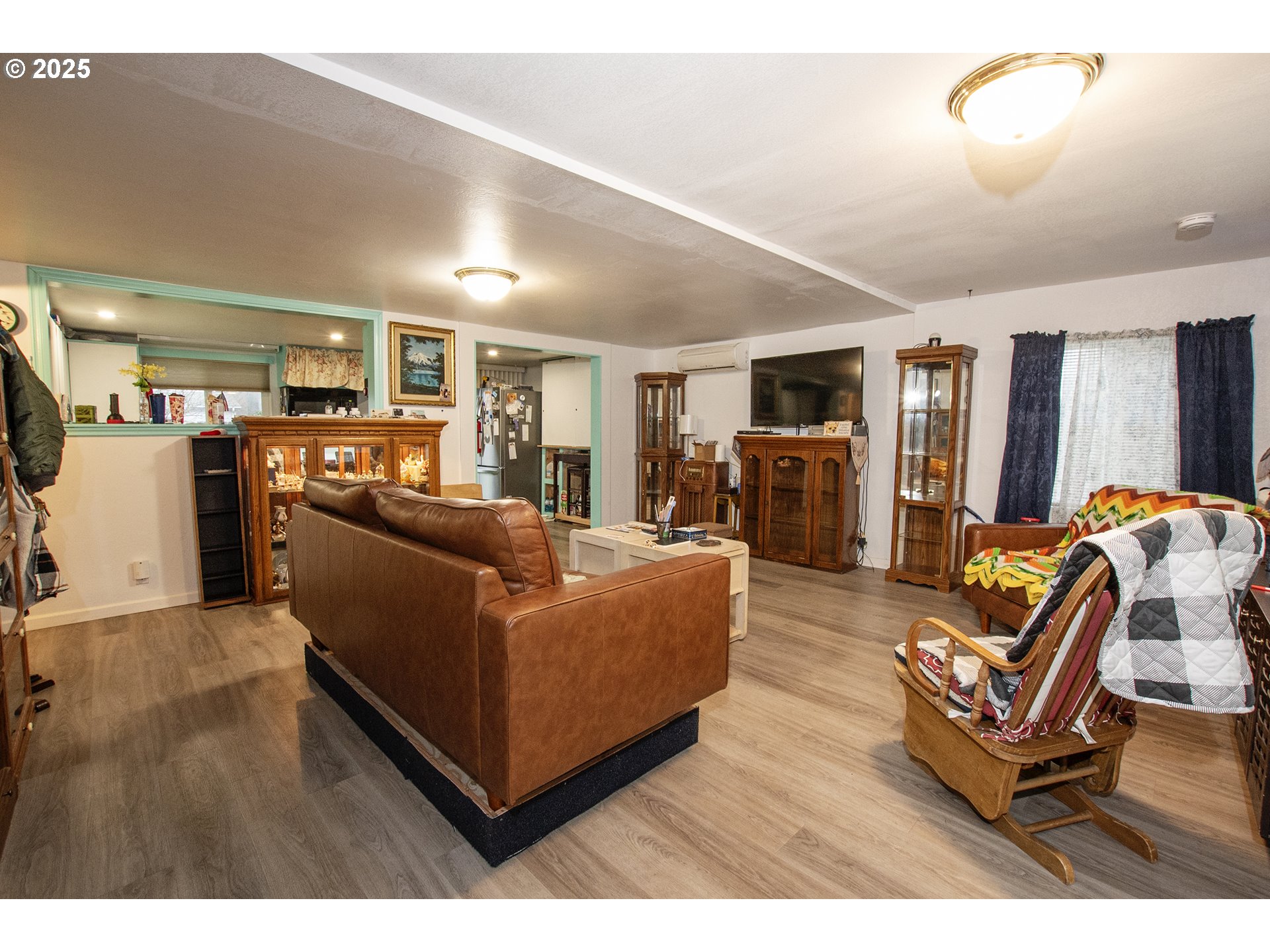 1253 30th Street Springfield, OR 97478 - Photo 3 of 15 a living room with furniture and a wooden floor