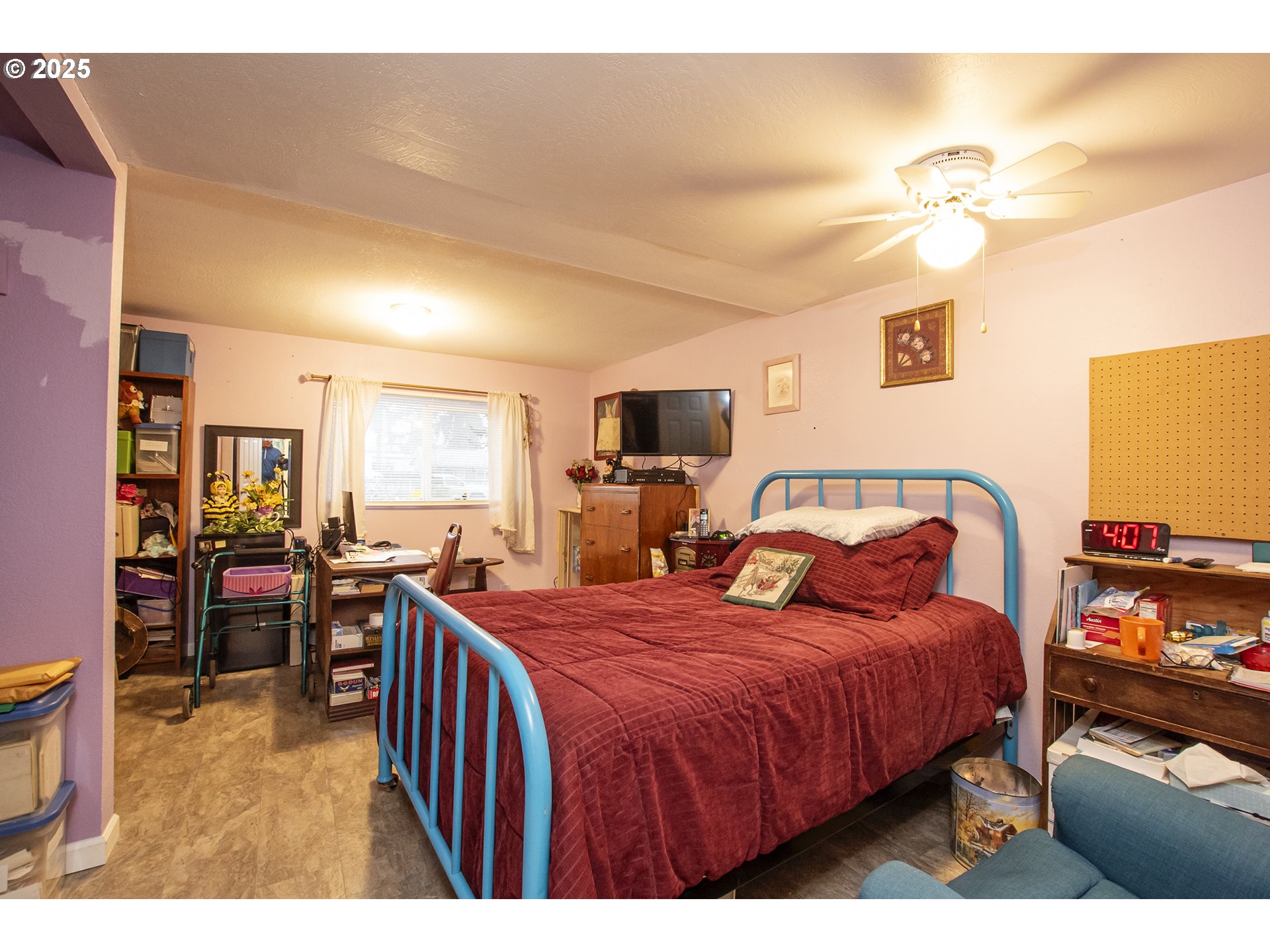 1253 30th Street Springfield, OR 97478 - Photo 7 of 15 a bedroom with a bed and a chandelier