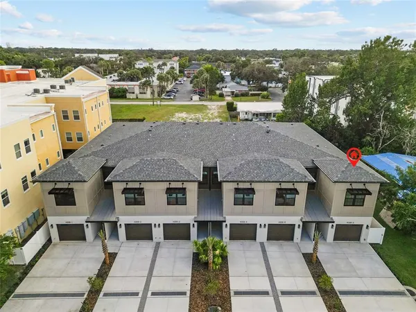 a aerial view of a house with a ocean view