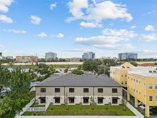 a front view of a residential apartment building with a yard