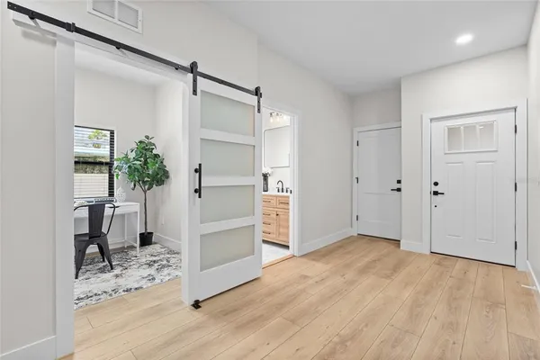 a view of kitchen space with wooden floor and electronic appliances