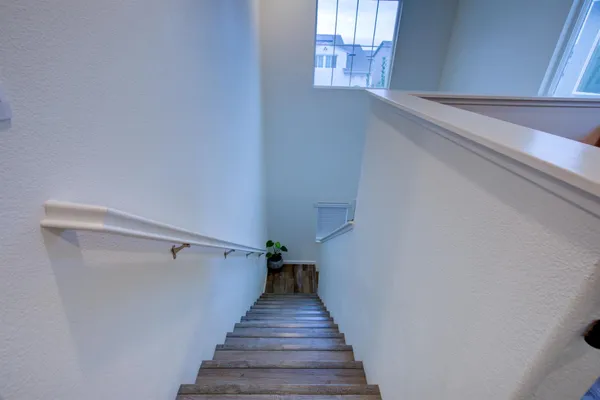 a view of a house with a backyard and porch
