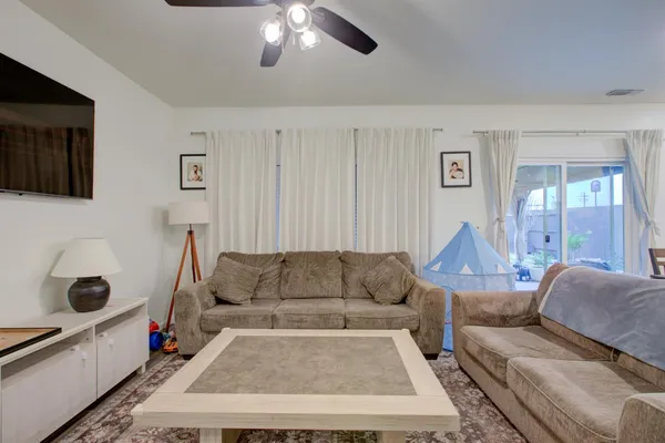 a white toilet sitting next to a shower