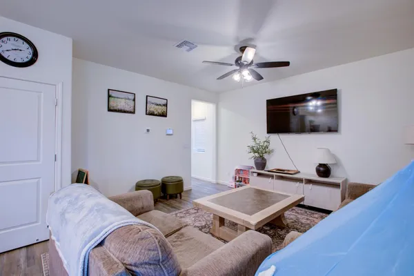 a spacious bathroom with a double vanity sink and a mirror