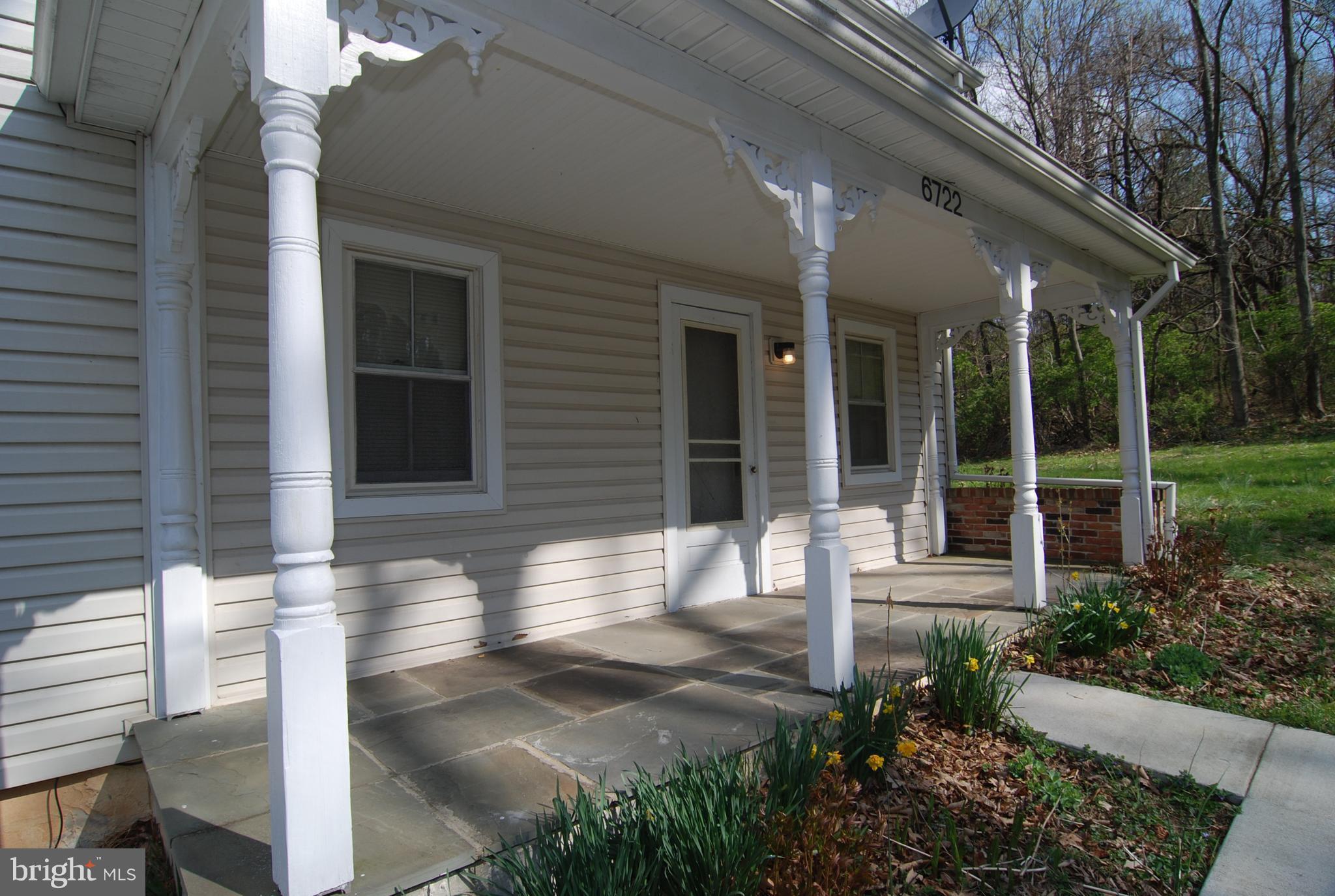 6722 South Clifton Road Frederick, MD 21703 - Photo 20 of 30 a front view of a house with garden