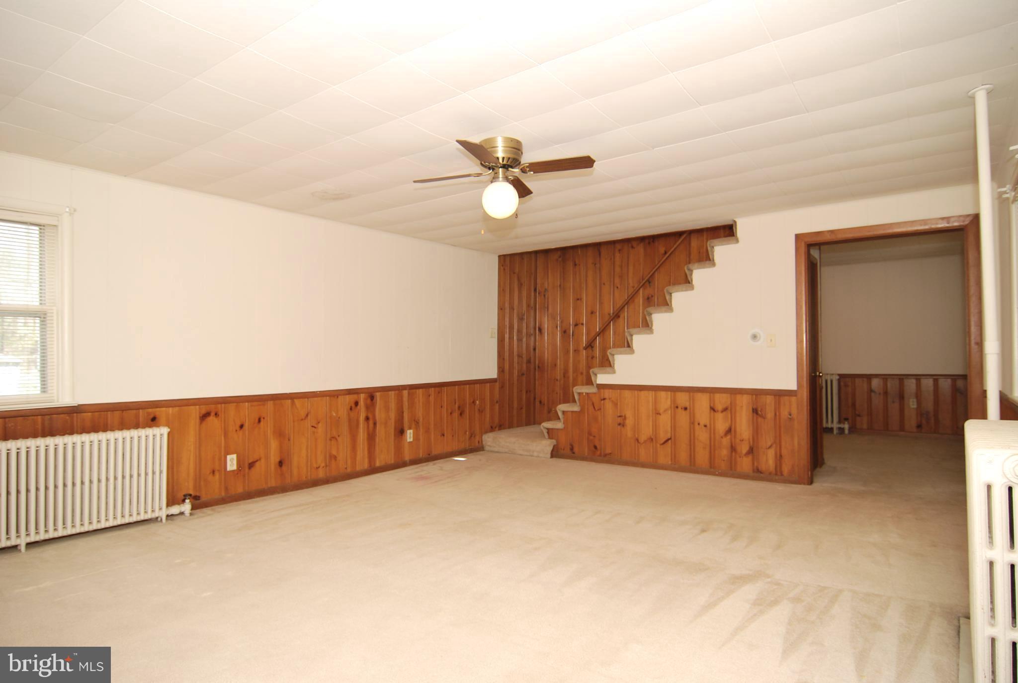 6722 South Clifton Road Frederick, MD 21703 - Photo 5 of 30 an empty room with chandelier fan and windows