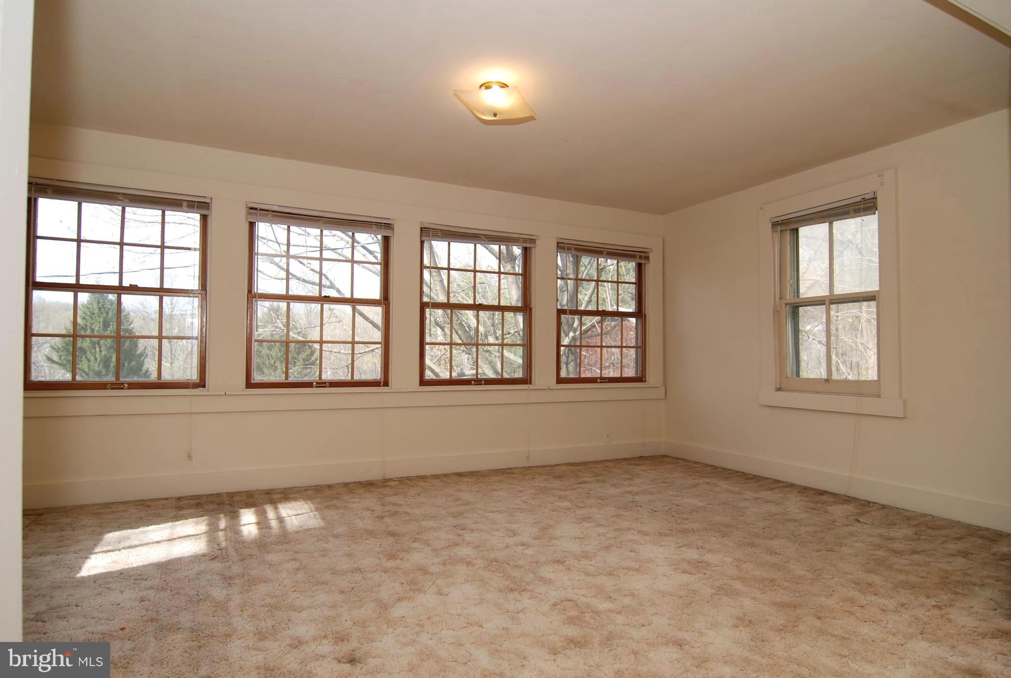 6722 South Clifton Road Frederick, MD 21703 - Photo 7 of 30 an empty room with a empty space and windows