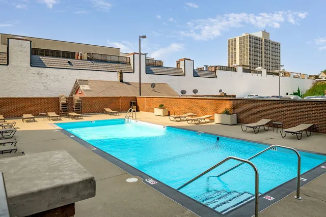 a view of a swimming pool with a lounge chairs
