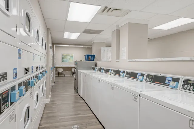 a kitchen with cabinets a sink and appliances