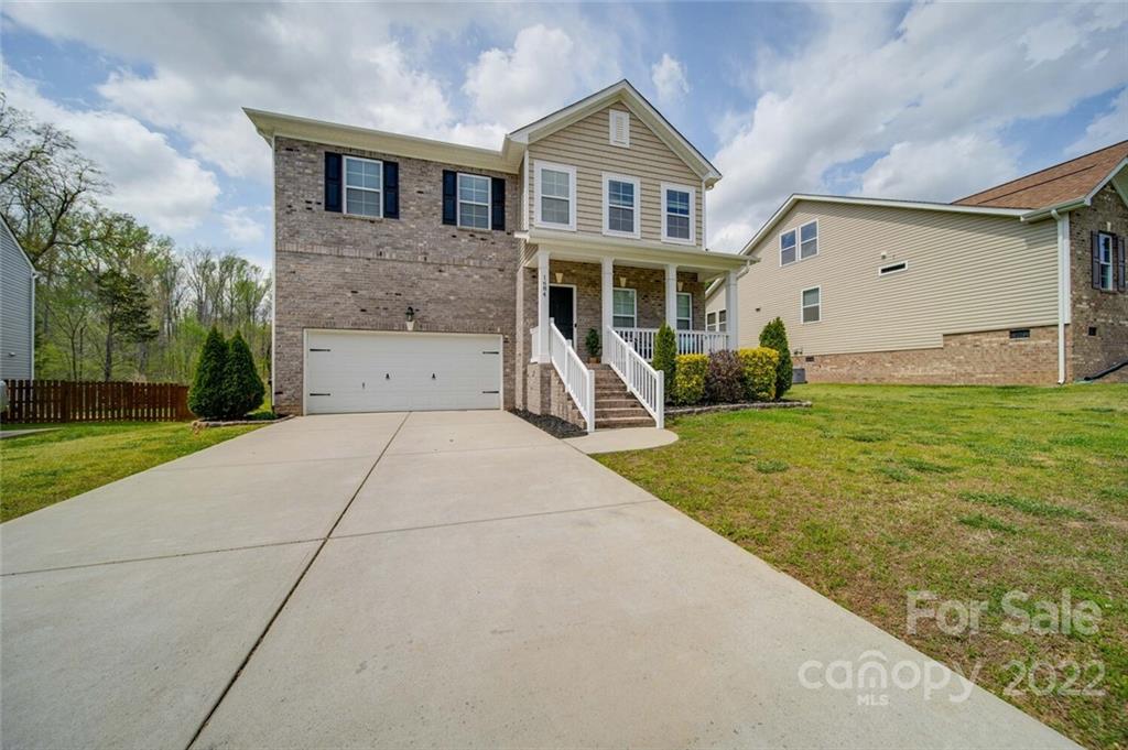 1684 Beleek Ridge Lane Clover, SC 29710 - Photo 1 of 20 a front view of a house with a yard and garage