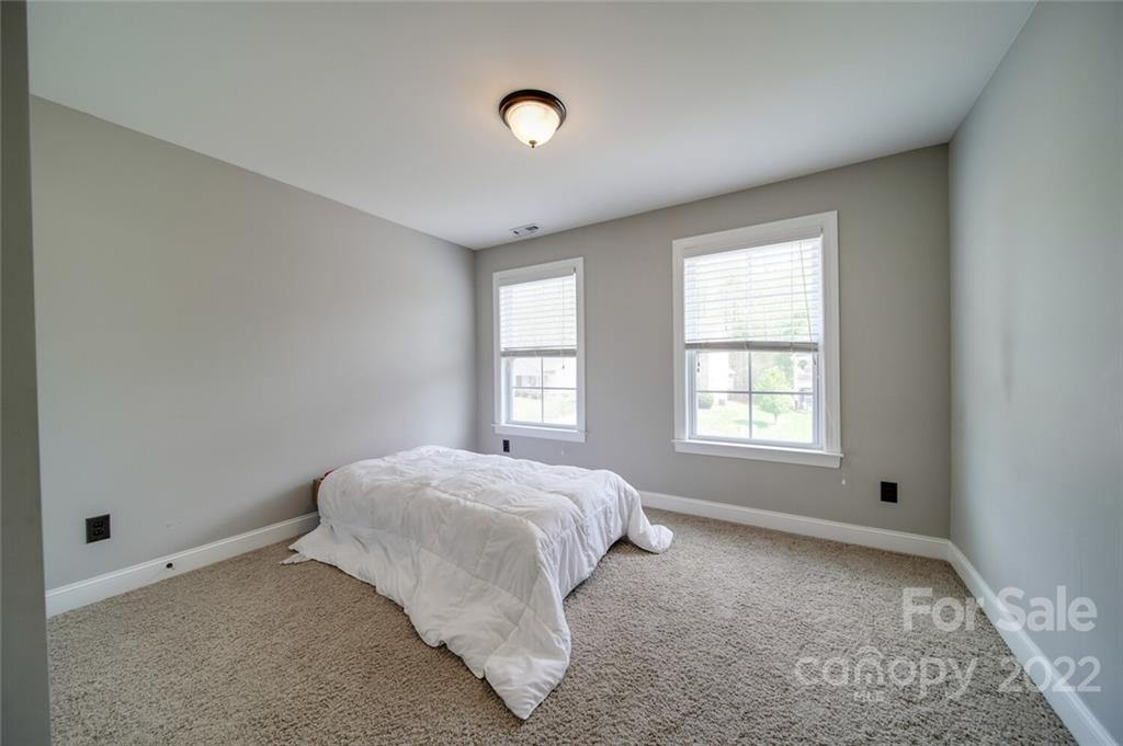1684 Beleek Ridge Lane Clover, SC 29710 - Photo 14 of 20 a spacious bedroom with a bed and a window