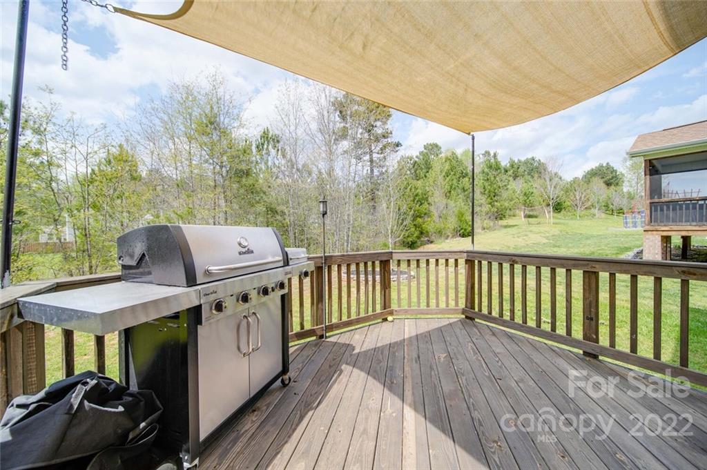 1684 Beleek Ridge Lane Clover, SC 29710 - Photo 20 of 20 a view of a two chairs with wooden floor and roof