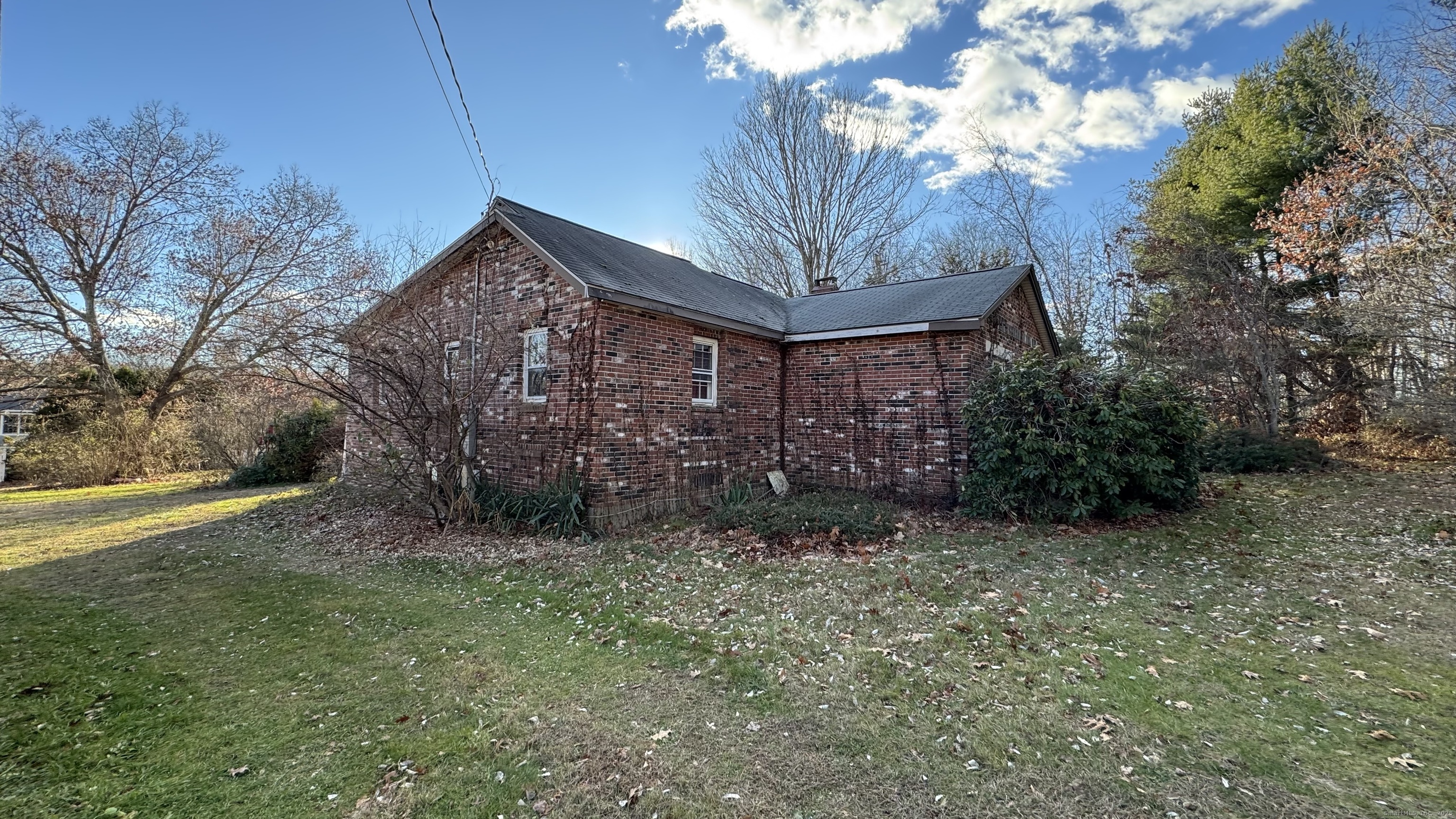 337 Hampton Road Chaplin, CT 06235 - Photo 3 of 5 a big room with lots of trees and plants