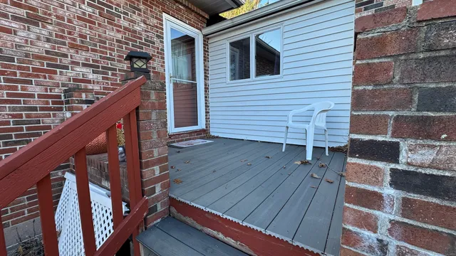 a view of deck with wooden floor and stairs