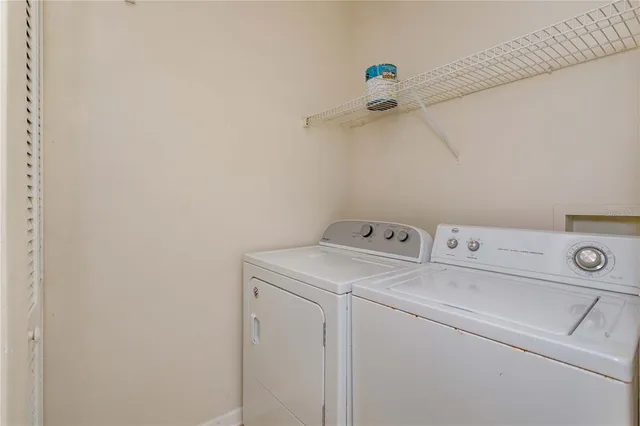 a utility room with dryer and washer
