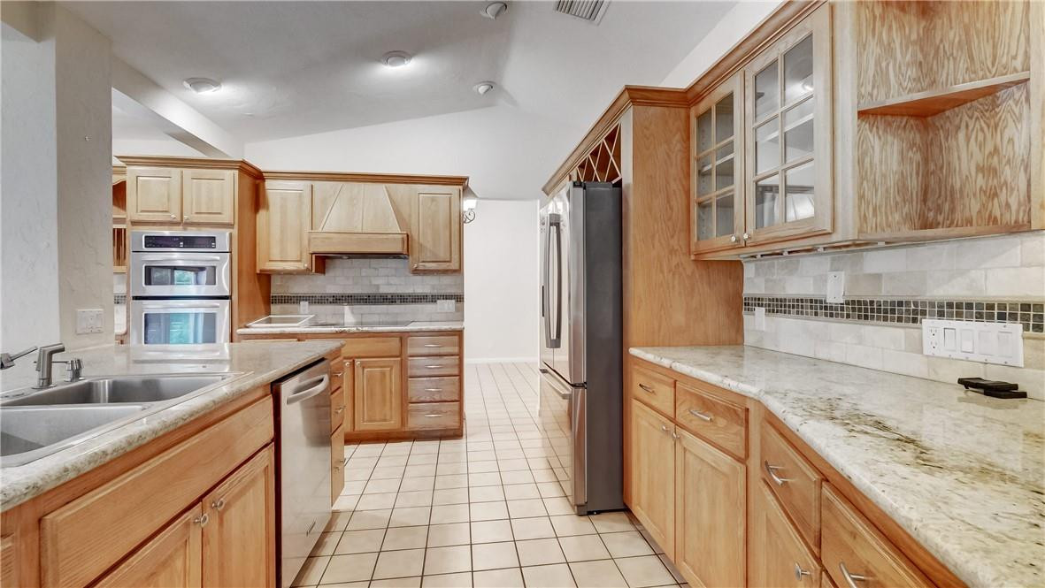 10890 Southwest 83rd Avenue Miami, FL 33156 - Photo 22 of 46 a kitchen with stainless steel appliances granite countertop a sink stove and cabinets