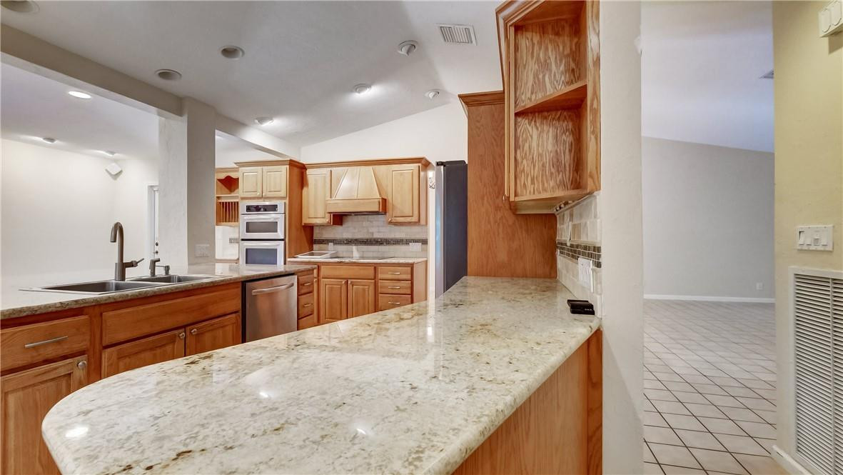 10890 Southwest 83rd Avenue Miami, FL 33156 - Photo 30 of 46 a kitchen with stainless steel appliances granite countertop a sink stove and refrigerator