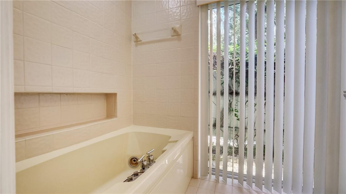 10890 Southwest 83rd Avenue Miami, FL 33156 - Photo 43 of 46 a bathroom with bathtub and shower