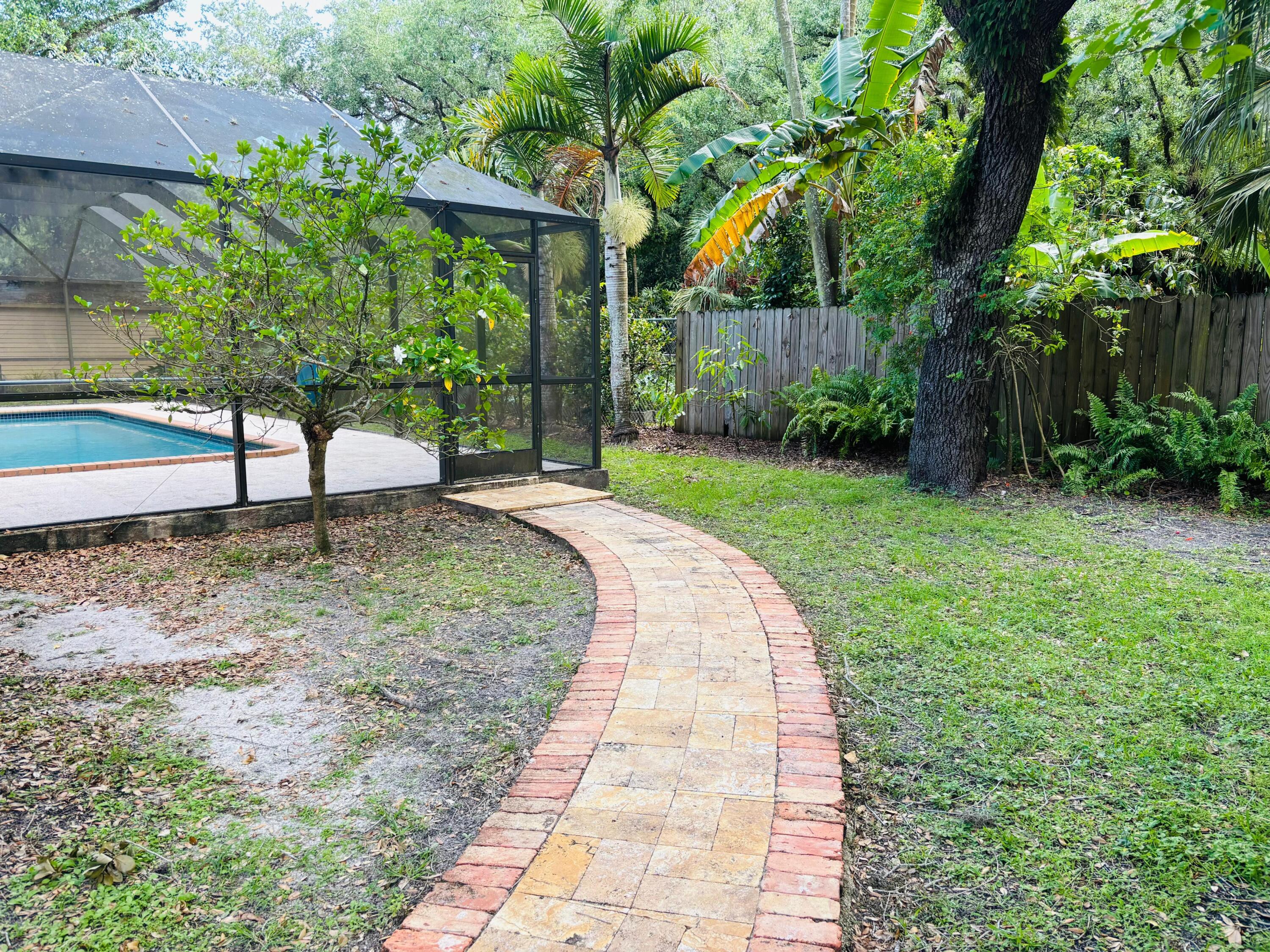 10890 Southwest 83rd Avenue Miami, FL 33156 - Photo 6 of 46 a view of a backyard with a garden