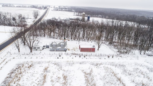 6353 South Ridge Road Oregon, IL 61061 - Photo 1 of 40 a view of a yard covered in snow