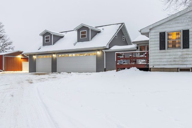 6353 South Ridge Road Oregon, IL 61061 - Photo 34 of 40 a front view of a house with a yard and garage