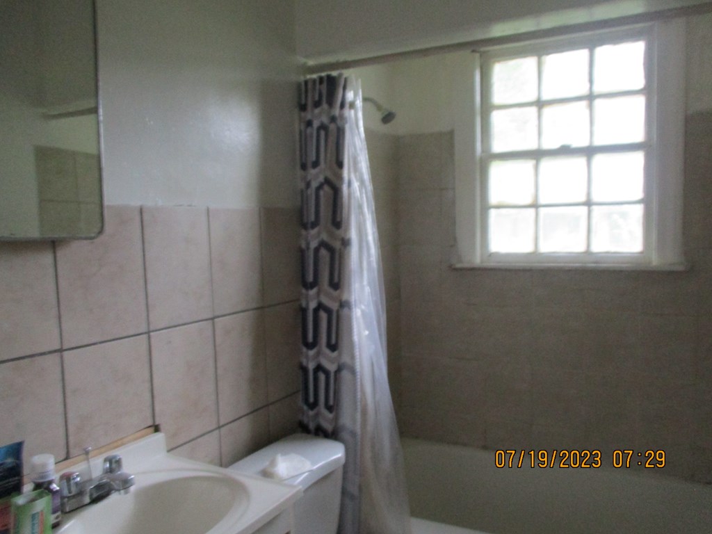 1036 Calvin Avenue Columbus, GA 31903 - Photo 13 of 23 a bathroom with a sink toilet and shower