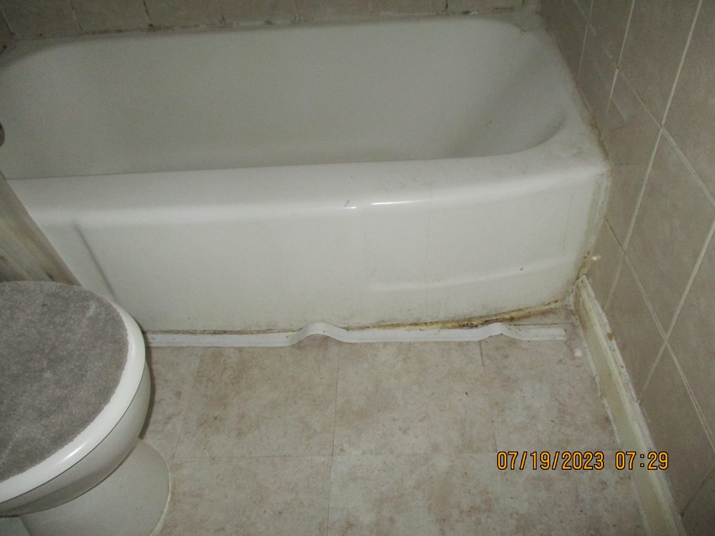 1036 Calvin Avenue Columbus, GA 31903 - Photo 15 of 23 a close up of a bathtub in a bathroom