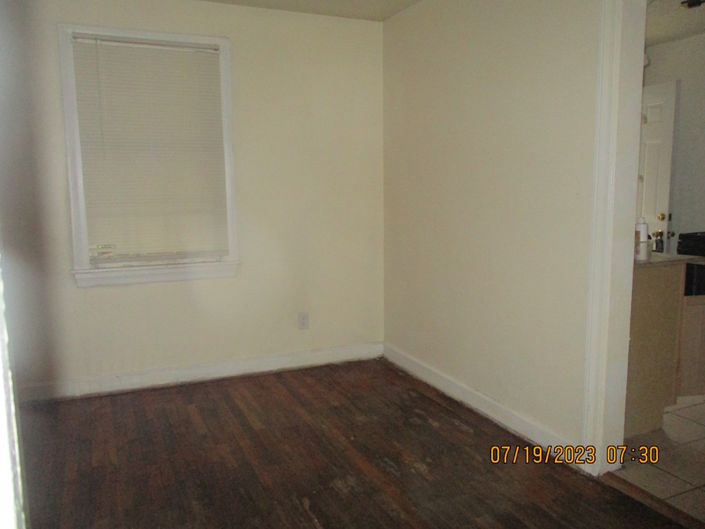 1036 Calvin Avenue Columbus, GA 31903 - Photo 16 of 23 an empty room with wooden floor