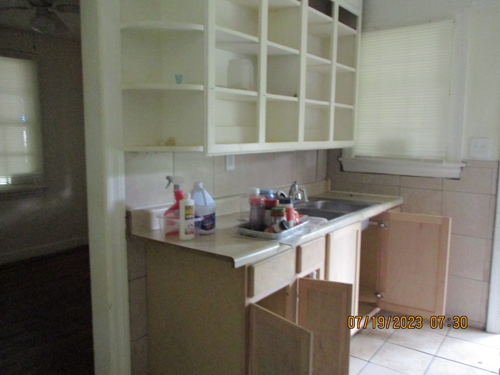 1036 Calvin Avenue Columbus, GA 31903 - Photo 20 of 23 a kitchen with a sink and cabinets