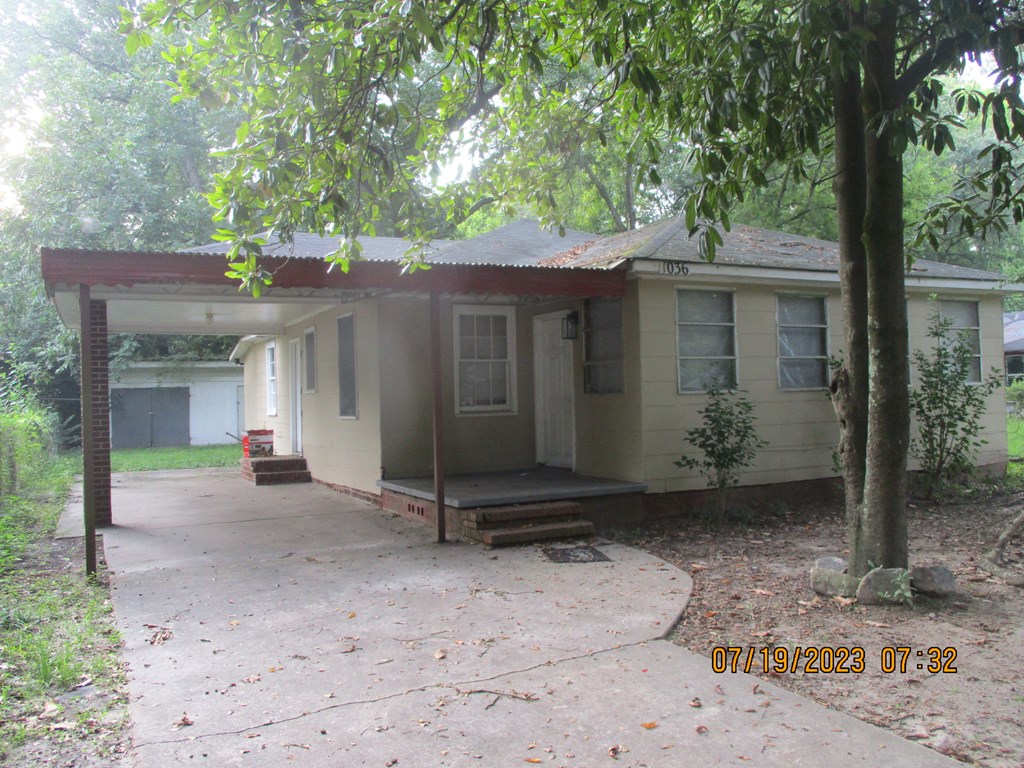 1036 Calvin Avenue Columbus, GA 31903 - Photo 23 of 23 a view of a house with a tree and wooden fence