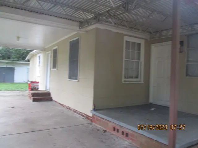 a backyard of a house with lots of green space