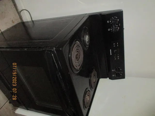 a view of a small space with wooden floor and a window