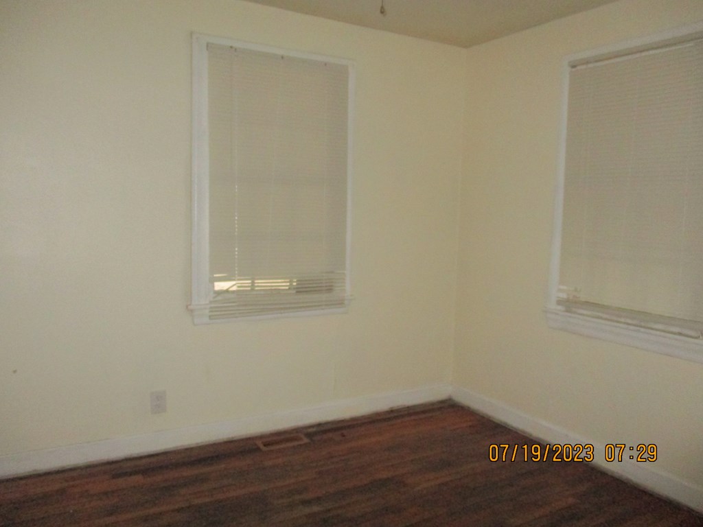 1036 Calvin Avenue Columbus, GA 31903 - Photo 9 of 23 a view of a small space with wooden floor and a window