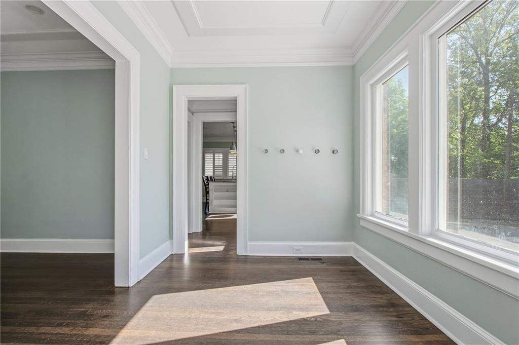 1417 Briarcliff Road Northeast Atlanta, GA 30306 - Photo 16 of 51 a view of an empty room with wooden floor and a window