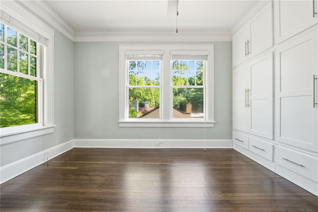 1417 Briarcliff Road Northeast Atlanta, GA 30306 - Photo 17 of 51 an empty room with wooden floor and windows