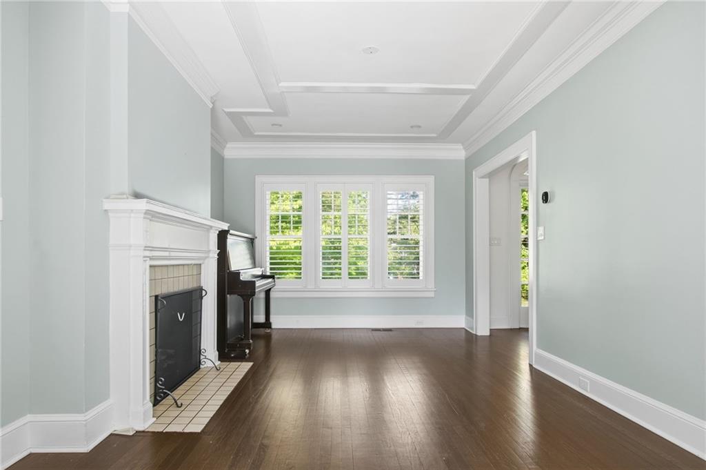 1417 Briarcliff Road Northeast Atlanta, GA 30306 - Photo 20 of 51 a view of an empty room with wooden floor and a window