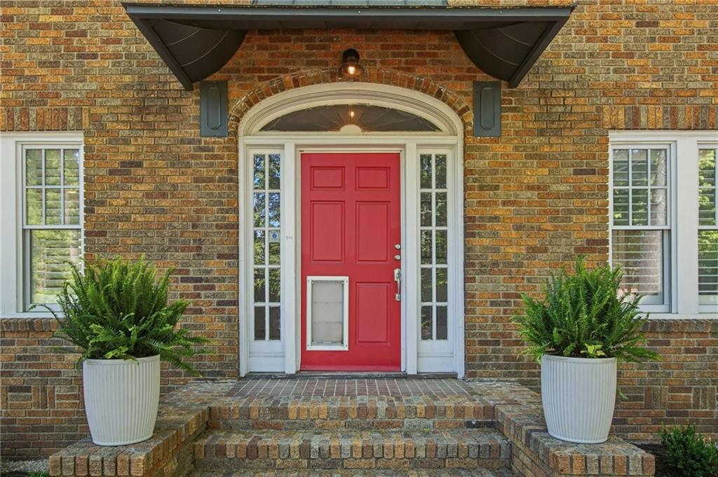 1417 Briarcliff Road Northeast Atlanta, GA 30306 - Photo 2 of 51 a front view of a house with potted plants