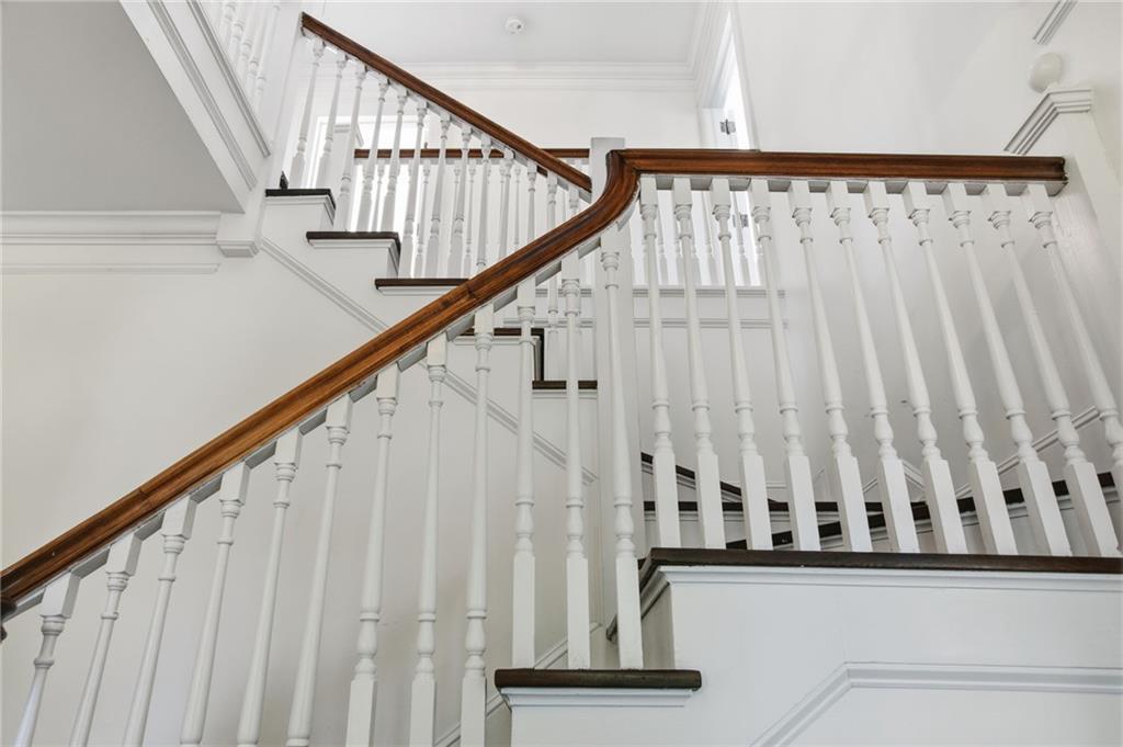 1417 Briarcliff Road Northeast Atlanta, GA 30306 - Photo 25 of 51 a view of staircase with railing and white walls