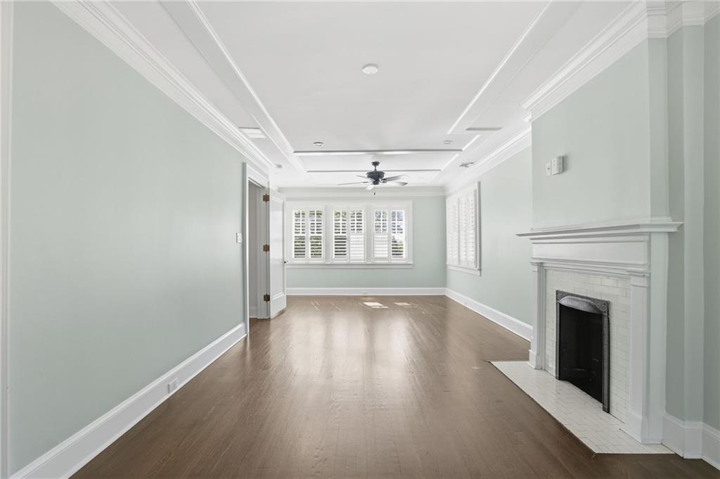 1417 Briarcliff Road Northeast Atlanta, GA 30306 - Photo 28 of 51 a view of an empty room with wooden floor and a window