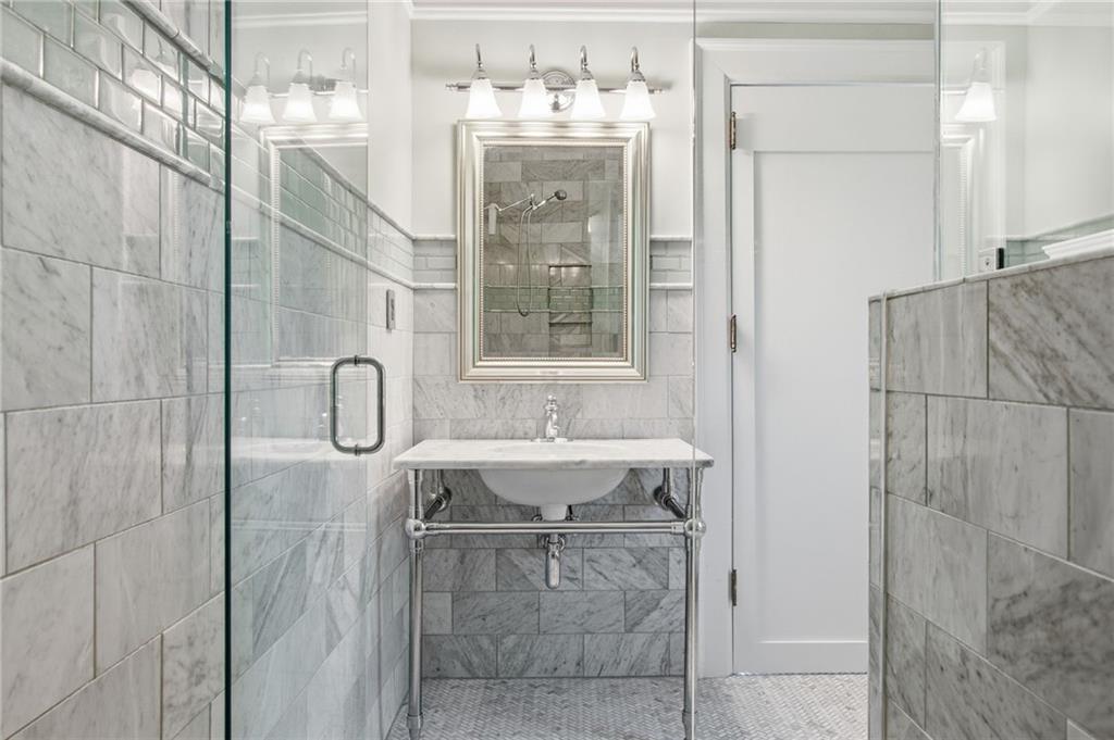 1417 Briarcliff Road Northeast Atlanta, GA 30306 - Photo 31 of 51 a bathroom with a bathtub and shower