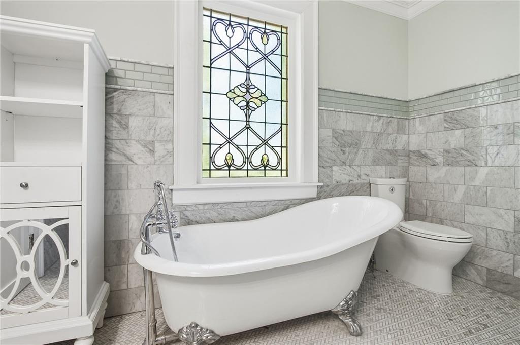 1417 Briarcliff Road Northeast Atlanta, GA 30306 - Photo 32 of 51 a white bath tub sitting next to a white toilet