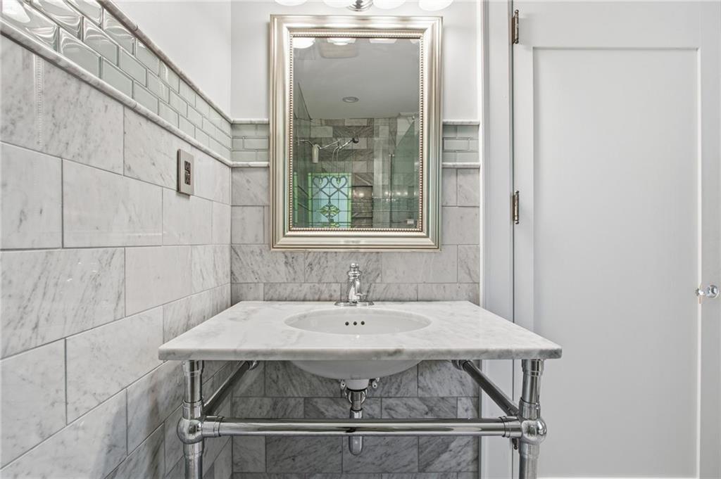 1417 Briarcliff Road Northeast Atlanta, GA 30306 - Photo 35 of 51 a bathroom with a sink and mirror