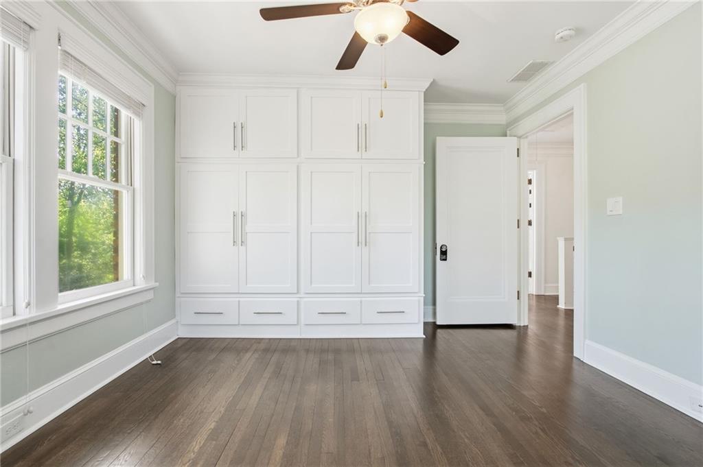 1417 Briarcliff Road Northeast Atlanta, GA 30306 - Photo 39 of 51 an empty room with wooden floor cabinet and windows