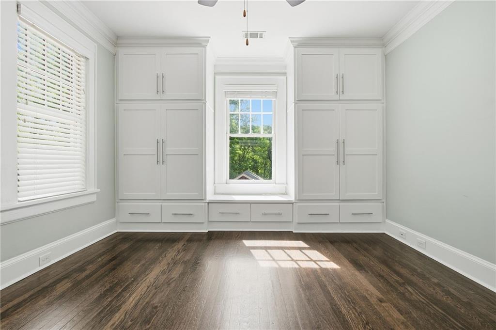 1417 Briarcliff Road Northeast Atlanta, GA 30306 - Photo 40 of 51 an empty room with wooden floor and windows