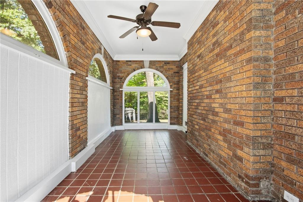 1417 Briarcliff Road Northeast Atlanta, GA 30306 - Photo 44 of 51 a view of a hallway with wooden floor and a chandelier