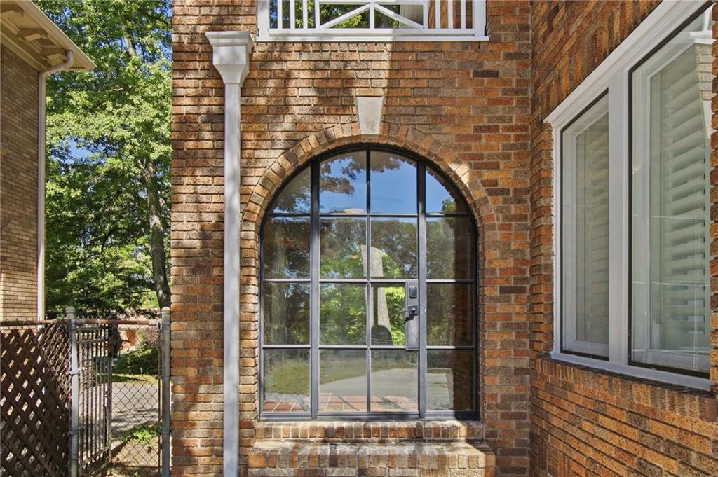 1417 Briarcliff Road Northeast Atlanta, GA 30306 - Photo 46 of 51 a front view of a house with a glass door