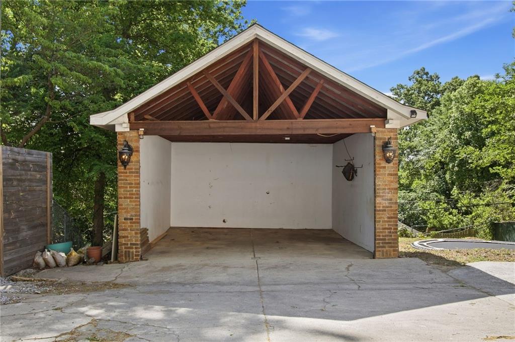 1417 Briarcliff Road Northeast Atlanta, GA 30306 - Photo 48 of 51 a front view of a house with garage
