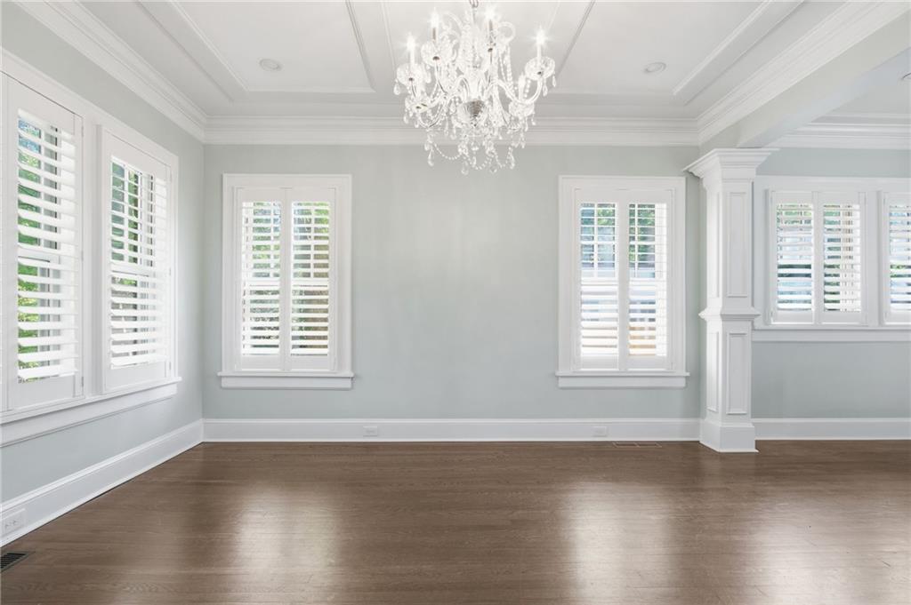 1417 Briarcliff Road Northeast Atlanta, GA 30306 - Photo 6 of 51 a view of an empty room with wooden floor and a window