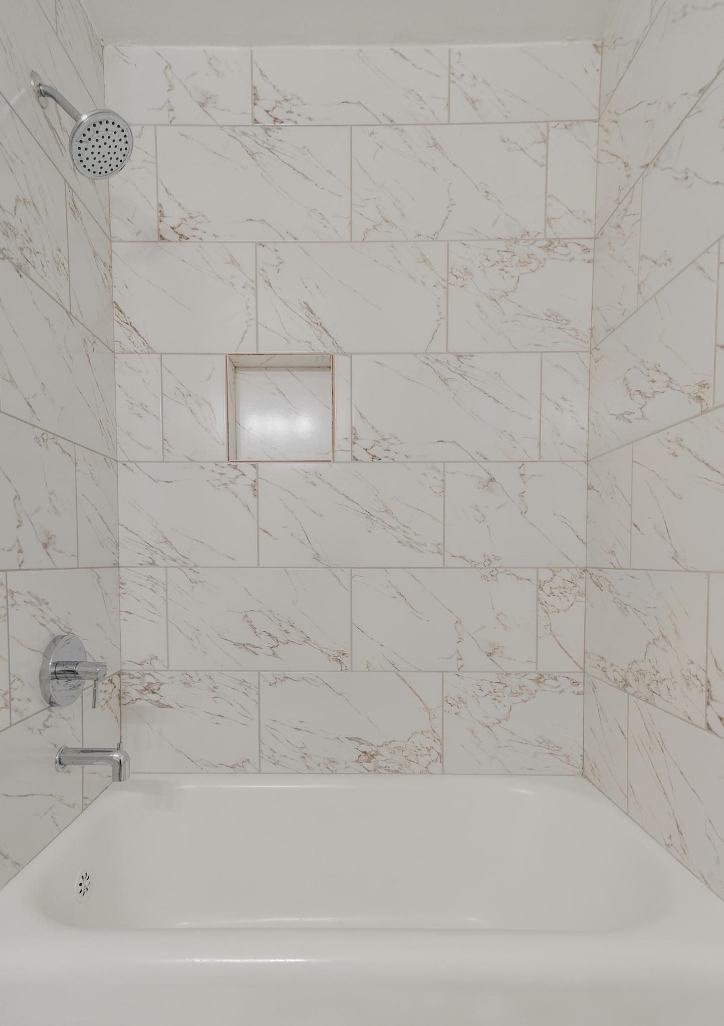 3704 Graves Road Memphis, TN 38116 - Photo 12 of 20 a bathroom with a bathtub