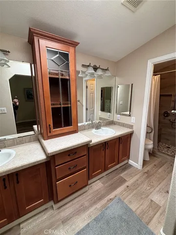 a bathroom with a double vanity sink and mirror